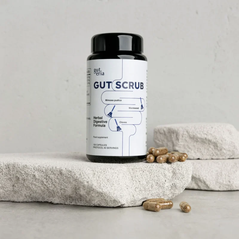 gut-scrub-1 Gut Scrub — frasco de 120 cápsulas sobre pedra